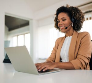 Portrait of a beautiful customer support operator with headset w