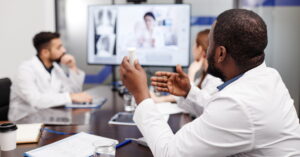 African-American healthcare worker talking at digital meeting